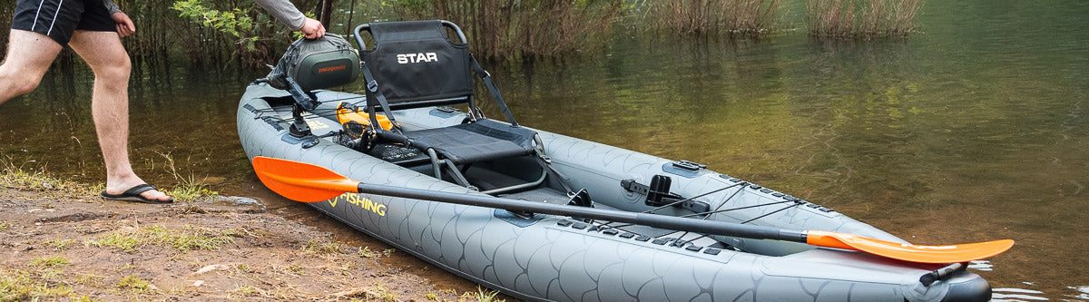 Pat loading accessories on the NRS Pike Inflatable Kayak