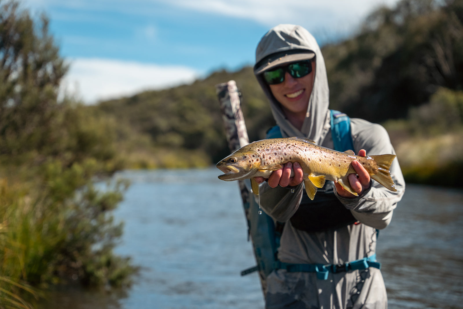 Pay Ryan holding a snowy mountains brown trout caught while fly fishing near Hains Hut in Kosciuszko National Park