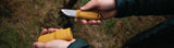 Pulling a Morakniv knife out of the sheath