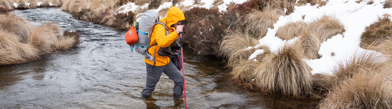 Kane braving a chilly crossing in kosciuszko NP.