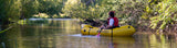Chloe paddling down the Tumut River in a Kokopelli packraft.